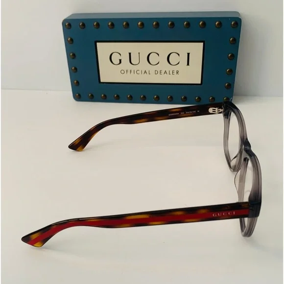 Gucci's GG0004ON features soft lines frames acetate front. Iconic web effect